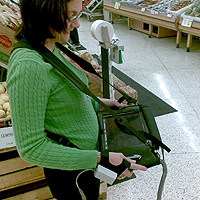 Figure P-3. This wearable scanner, attached to a Tablet PC (used for inventory control), is representative of trends in workplace computing: contextually useful so that the operator has it with her constantly, and connected so that the enterprise can use the intelligence immediately.